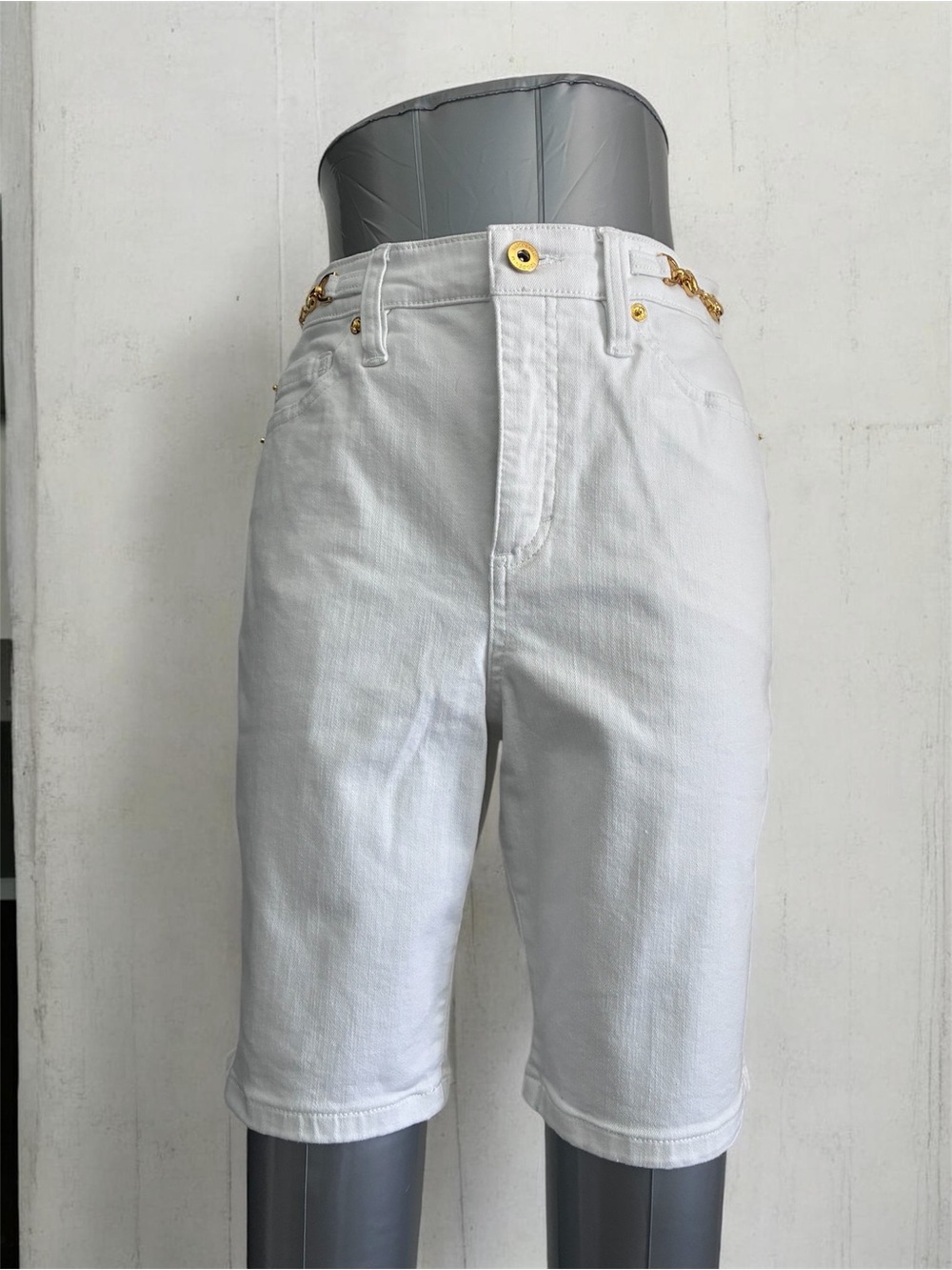 I.N.C. Bermuda women shorts feature a distinctive gold-tone chain detail across
